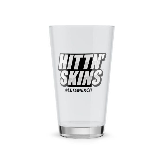 a pint glass with hittn skins logo