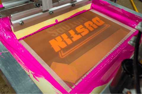 a shirt being screen printed