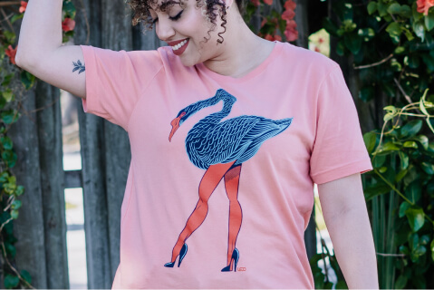a swan with legs on a pink shirt