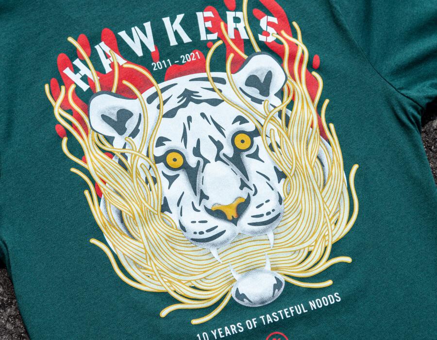 Teal t-shirt with a multi-color white tiger and noodle illustration printed for a restaurant anniversary design.