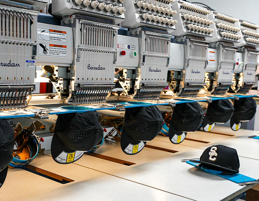 Team snapbacks being embroidered at Hittn' Skins in Orlando, FL 