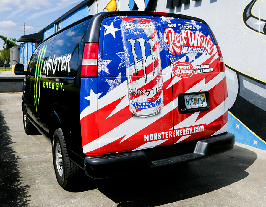 Monster Energy Red White and Blue promotional van wrap with Ultra energy drink can graphics and custom commercial vehicle branding.